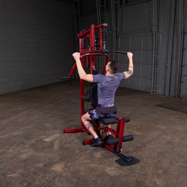 White male athlete performing lat pulldown on the Best Fitness by Body-Solid Single Stack Home Gym BFMG30.