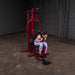 Female athlete executing an ab crunch using the mid pulley on the Best Fitness by Body-Solid Single Stack Home Gym BFMG30.