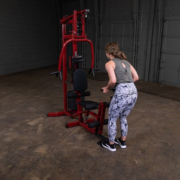 Female athlete doing forward standing underhand grip rows from the low cable on the Best Fitness by Body-Solid Single Stack Home Gym BFMG30