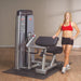 Athlete standing at the Body-Solid Pro Dual Bicep/Tricep Machine DBTC-SF