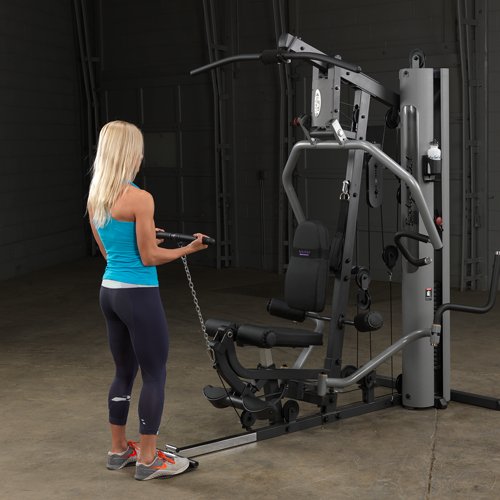 Female athlete performing standing bicep curl from low cable on Body-Solid G5S Home Gym.