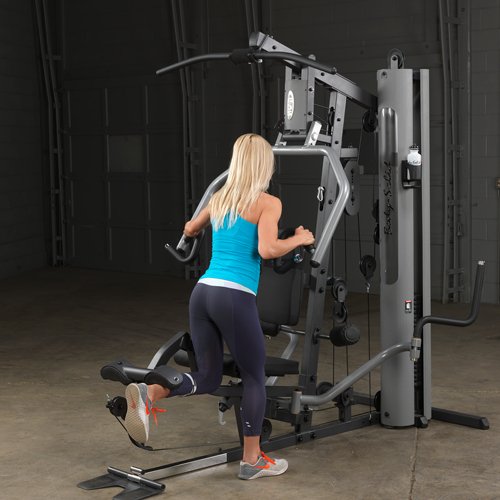 Female athlete performing single leg standing curl on Body-Solid G5S Home Gym with low cable attachment.