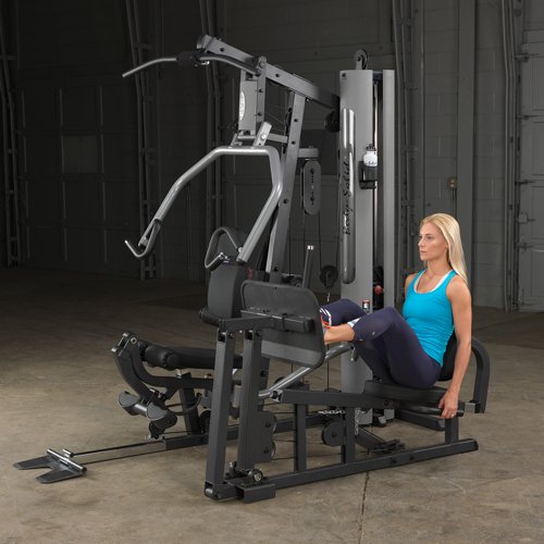 Female athlete using optional leg press attachment on Body-Solid G5S Home Gym for lower body workout.