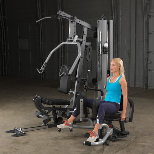 Female athlete performing hip adductor exercise with optional attachment on Body-Solid G5S Home Gym