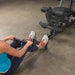 Female athlete performing low row exercise using low row cable attachment on Body-Solid G5S Home Gym.