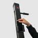 Close-up of a phone being fitted into the holder on a Bluetooth-compatible VersaClimber H model, demonstrating how to securely place the device for seamless access to fitness apps and Bluetooth-enabled workout tracking.
