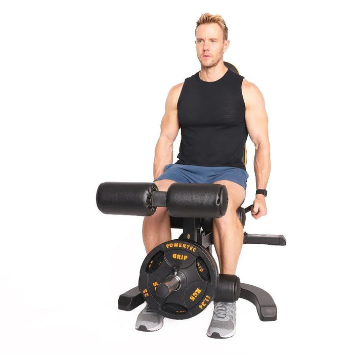 Athlete using the Powertec WB-LLA Leg Lift-Curl Attachment on a Workbench

