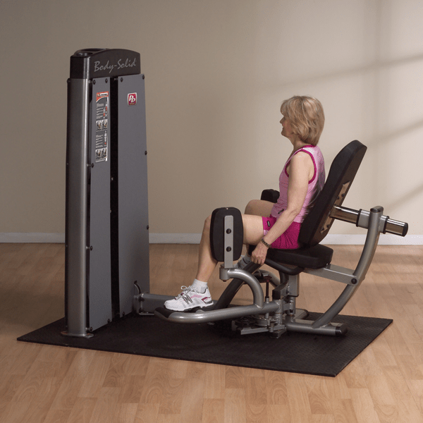 Older woman performing an exercise on the Body-Solid Pro Dual Inner/Outer Thigh Machine DIOT-SF