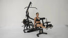 Powertec WB-LLA Leg Lift-Curl Attachment connected to a Powertec Workbench as part of lever gym