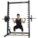 Athlete performing a squat with barbell and weights on the Powertec Roller Smith Machine WB-RS