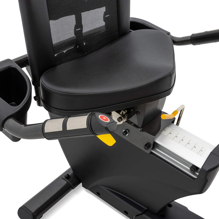 Close-up view of the Spirit Fitness XBR95 Recumbent Bike's adjustable high-density foam seat and ergonomic handlebars with integrated pulse sensors.
