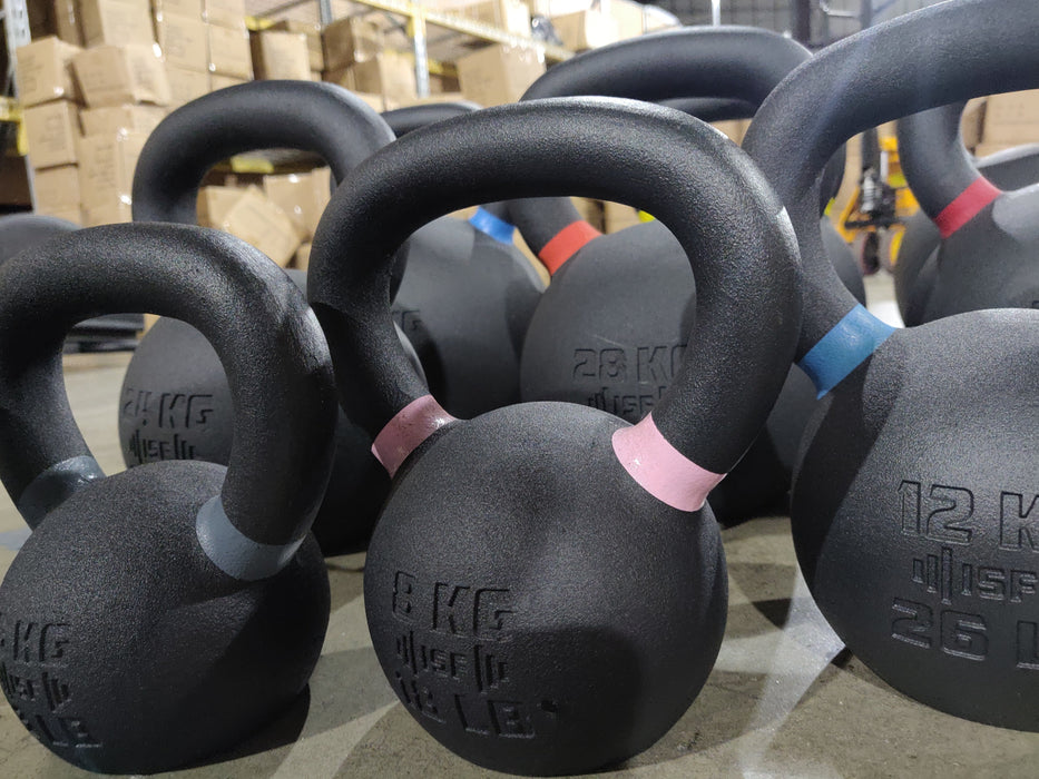Close-up of ISF kettlebells on the warehouse floor.