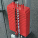 Close-up view of the optional red weight plate stack on the Body Solid Home Gym G3S.